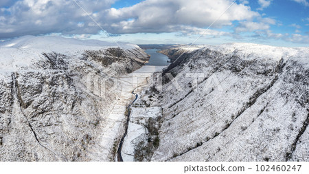 The snow covered Glenveagh Mountains and Glen in County Donegal - Republic of Ireland 102460247