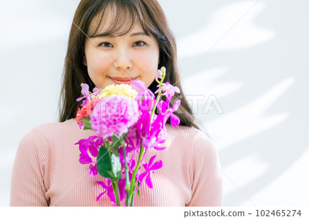 A woman with a bouquet A woman with a bouquet 102465274