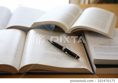 Image of English books opened on the desk, research, learning, re-learning Image of English books opened on the desk, research, learning, re-learning 102470175