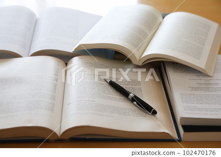 Image of English books opened on the desk, research, learning, re-learning 102470176