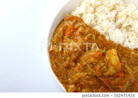 Curry rice with melted ingredients Curry with most of the ingredients melted apart from the potatoes 102471428