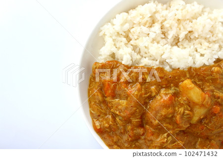 Curry rice with melted ingredients Curry with most of the ingredients melted apart from the potatoes 102471432