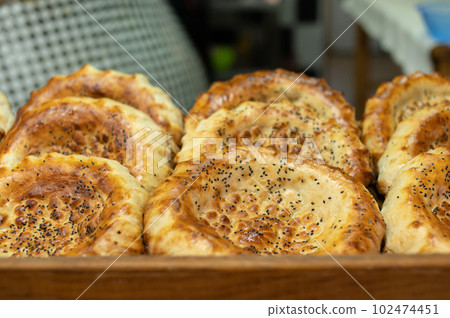 Fresh Armenian bread is on the counter, lavash is on display 102474451