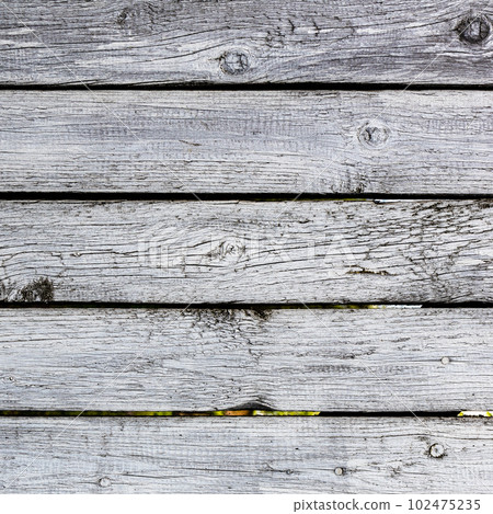 shabby white painted planks close up of old fence 102475235