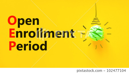 OEP symbol. Concept words OEP Open enrollment period on beautiful yellow paper. Light bulb icon. Beautiful yellow table yellow background. Medical and OEP Open enrollment period concept. Copy space. 102477104