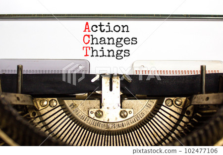 ACT action changes things symbol. Concept words ACT action changes things typed on old retro typewriter. Beautiful white background. Business and ACT action changes things concept. Copy space. 102477106