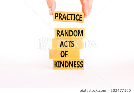 Practice random kind of kindness symbol. Concept words Practice random kind of kindness on wooden block. Beautiful white background. Businessman hand. Business practice kindness concept. Copy space. Practice random kind of kindness symbol. Concept words Practice random kind of kindness on wooden block. Beautiful white background. Businessman hand. Business practice kindness concept. Copy space. 102477160