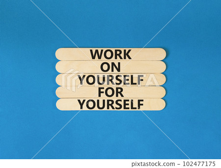 Work for yourself symbol. Concept words Work on yourself for yourself on wooden stick. Beautiful blue table blue background. Business and work for yourself concept. Copy space. 102477175