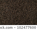 Background of black fanning or broken loose leaf tea. Close up, top view. 102477600
