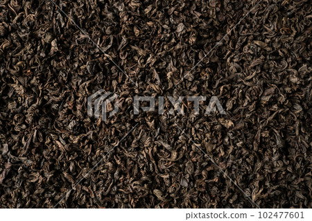Background of black fanning or broken loose leaf tea. Close up, top view. 102477601