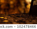 Bunch of coins in a warm light 102478466