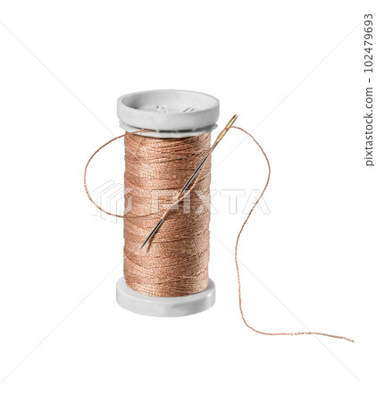 Thread spool on white. 102479693