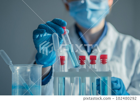 A chemist, a scientist in the laboratory, studies the interaction of chemicals to create new technologies in medicine. In the laboratory analyzes biological samples to study the causes of the disease. A chemist, a scientist in the laboratory, studies the interaction of chemicals to create new technologies in medicine. In the laboratory analyzes biological samples to study the causes of the disease. 102480292