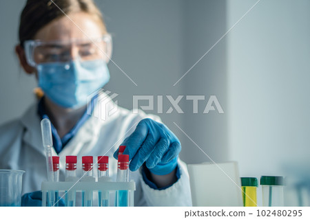 A chemist in the laboratory develops new methods for researching medicines. A medical researcher in a laboratory is testing for a new drug for the treatment of cardiovascular disease. A chemist in the laboratory develops new methods for researching medicines. A medical researcher in a laboratory is testing for a new drug for the treatment of cardiovascular disease. 102480295