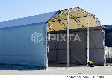 Unfinished large prefabricated arched metal frame tent hangar covered with polyvinyl chloride fabric Unfinished large prefabricated arched metal frame tent hangar covered with polyvinyl chloride fabric 102480305