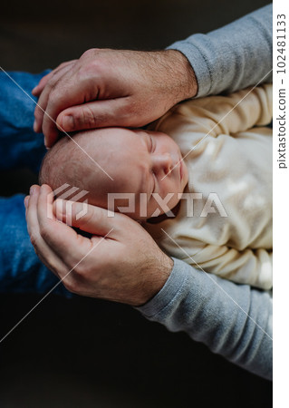 Close-up of father cudddling his little son. Close-up of father cudddling his little son. 102481133