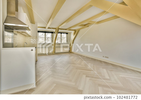 an empty room with wood flooring and white appliances on the wall in this photo is taken from the inside 102481772