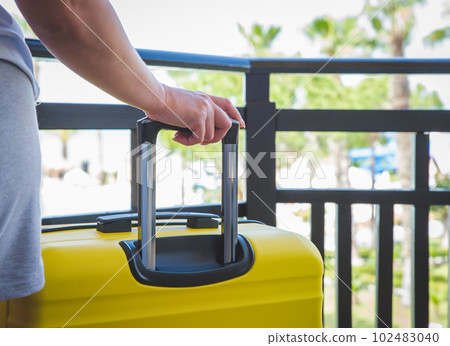 Travel. Staycation.local travel new normal.Girl packing luggage in suitcase and travel documents Travel,tourism,vacation,relocation. Travel. Staycation.local travel new normal.Girl packing luggage in suitcase and travel documents Travel,tourism,vacation,relocation. 102483040