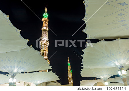 Prophet Mosque minarets with umbrellas in the foreground, Medina, Saudi Arabia Prophet Mosque minarets with umbrellas in the foreground, Medina, Saudi Arabia 102483114