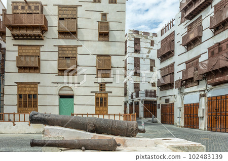 Al-Balad old town with traditional muslim houses and old cannons in the foreground, Jeddah, Saudi Arabia Al-Balad old town with traditional muslim houses and old cannons in the foreground, Jeddah, Saudi Arabia 102483139