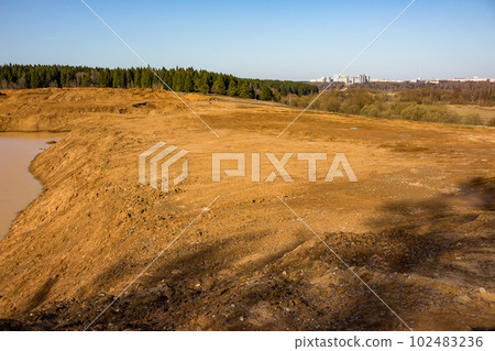 Part of the quarry filled with soil, sand pit reclamation 102483236