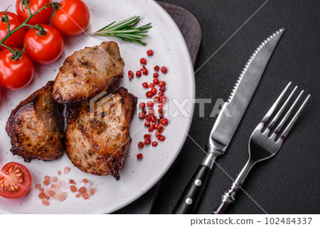 Delicious grilled meat in the form of a kebab with spices and herbs Delicious grilled meat in the form of a kebab with spices and herbs 102484337