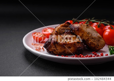 Delicious grilled meat in the form of a kebab with spices and herbs 102484344
