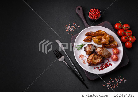 Delicious grilled meat in the form of a kebab with spices and herbs 102484353