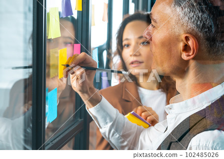 Team of happy people work together as teamwork and partner 102485026