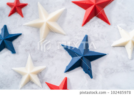 Homemade color chocolate stars that are made from color chocolate molds. 102485978
