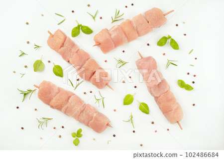 Raw chicken.Skewers from raw chicken meat fillet for supermarket on white background.Food for retail.Chicken skewers.Chicken breast Fillets Procurement for designers.Ogranic food,healthy eating. 102486684