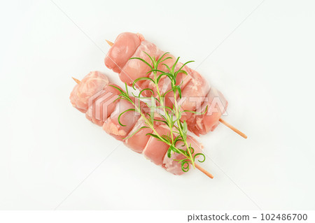 Skewers from raw chicken leg meat without skin for a supermarket on a white background.Food for retail.Chicken skewers.Chicken meat.Procurement for designers. Skewers from raw chicken leg meat without skin for a supermarket on a white background.Food for retail.Chicken skewers.Chicken meat.Procurement for designers. 102486700