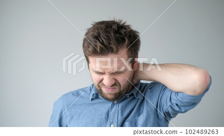 Caucasian man has neck and shoulder pain. Caucasian man has neck and shoulder pain. 102489263