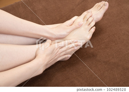 A woman with foot care A woman with foot care 102489328