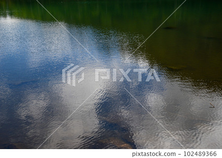 The view of Kita Yatsugatake Futago Pond where the blue sky is reflected on the surface of the lake 102489366