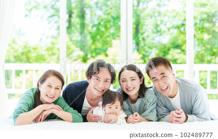 Three generation family portrait 102489777