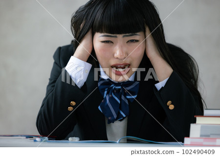 high school girl tired of studying 102490409