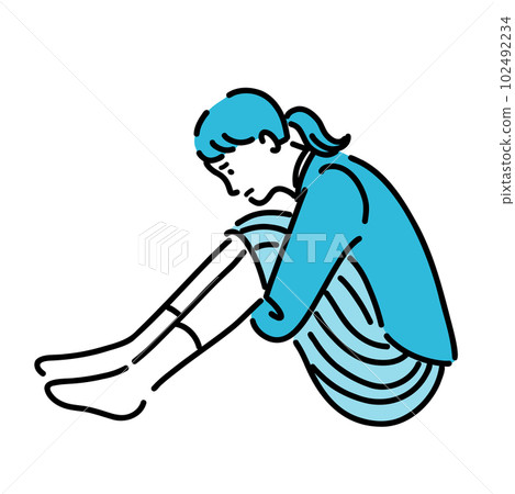 A woman suffering from depression holding her knees 102492234