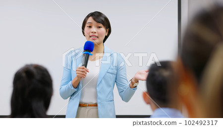 teacher in adult education class 102492317