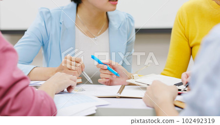 teacher in adult education class 102492319