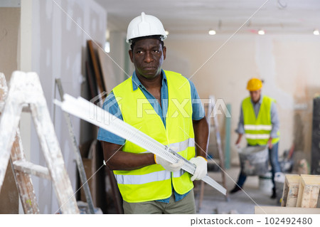 Repairman working in construction site in apartment 102492480