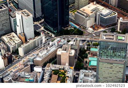 Aerial view of skyscrapers and expressways in Tokyo Japan 102492523