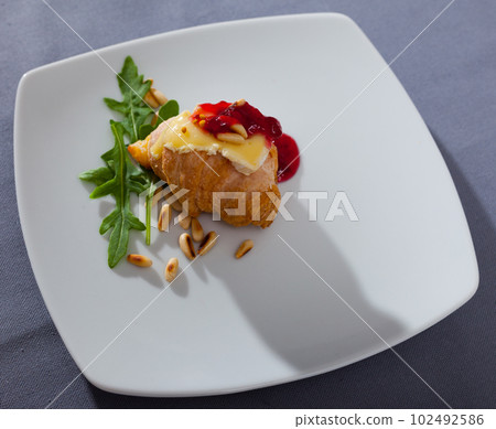 Mini croissant with camembert, jam, pine nuts Mini croissant with camembert, jam, pine nuts 102492586