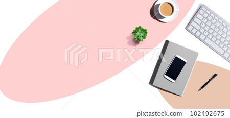 Desk items - keyboard, smart phone, coffee and a pen 102492675