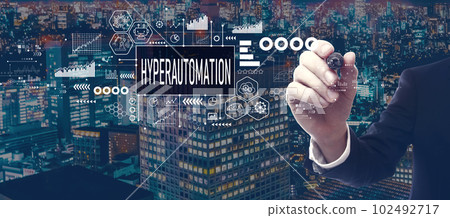 Hyperautomation theme with businessman in city at night 102492717