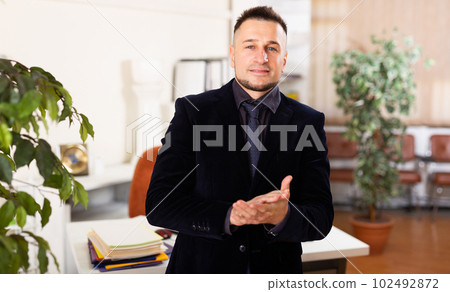 Businessman sanding in his office 102492872