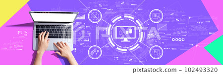 Stock trading theme with person using a laptop Stock trading theme with person using a laptop 102493320