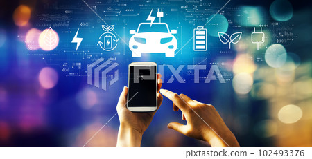 EV concept with person using smartphone 102493376