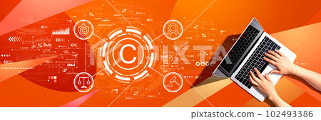 Copyright concept with person using a laptop Copyright concept with person using a laptop 102493386