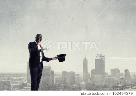 Male illusionist performing tricks . Mixed media Male illusionist performing tricks . Mixed media 102494579
